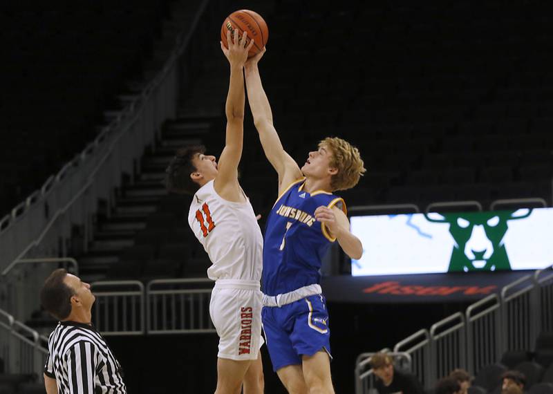 McHenry's Hayden Stone battles for the tip-off with Johnsburg's Jake Metze during a non-conference basketball game Sunday, Nov. 27, 2022, between Johnsburg and McHenry at Fiserv Forum in Milwaukee.