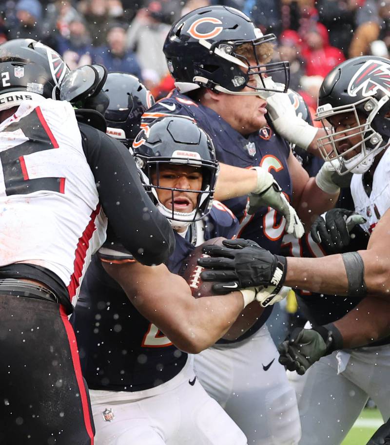 Chicago Bears running back Roschon Johnson scores a touchdown during their game against the Atlanta Falcons Sunday, Dec. 31, 2023, at Soldier Field in Chicago.