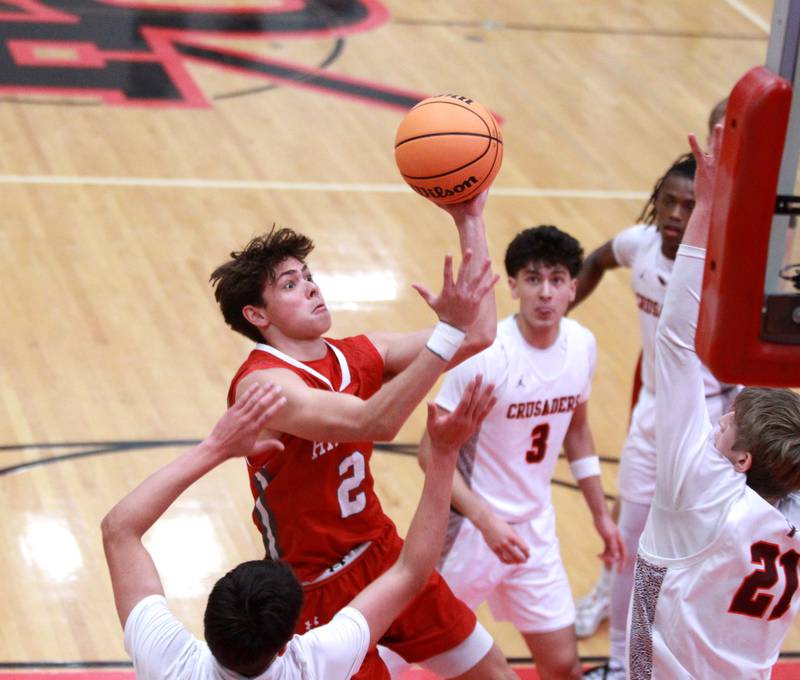 Hinsdale Central’s Dillon Orozco gets the ball up during the Hinsdale Holiday Classic championship game against Brother Rice on Monday, Dec. 30, 2024 in Hinsdale.