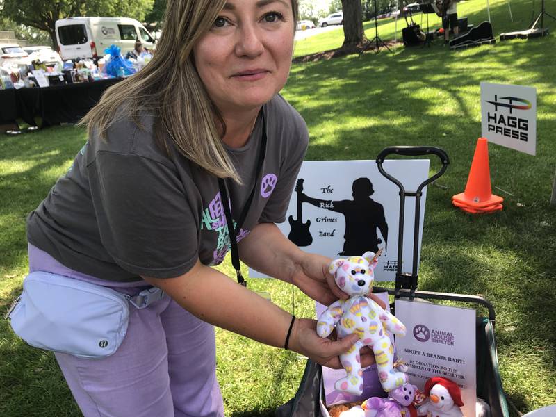 Sylvia Copil holds up a Beanie Baby at Pawfest in Huntley Aug. 3, 2024.