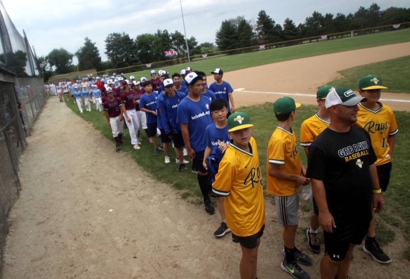 Teams parade in during MCYSA 2023 Summer International Championships Opening Ceremonies Friday June, 14, 2023 at the Mickey Sund Complex in Lippold Park in Crystal Lake.