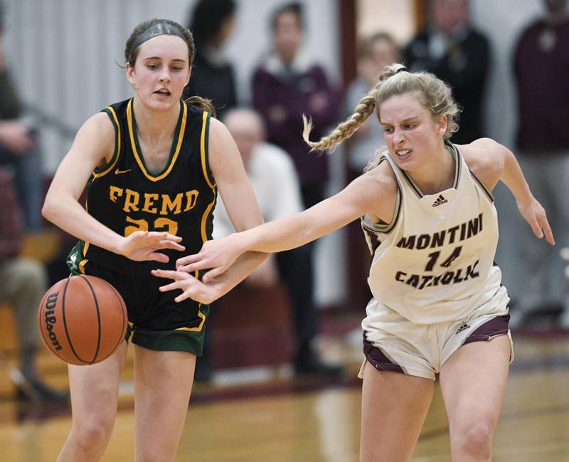 Montini’s Shannon Blacher taps the ball away from Fremd’s Ella Todd in a girls basketball game in Lombard on Monday, January 23, 2023.
