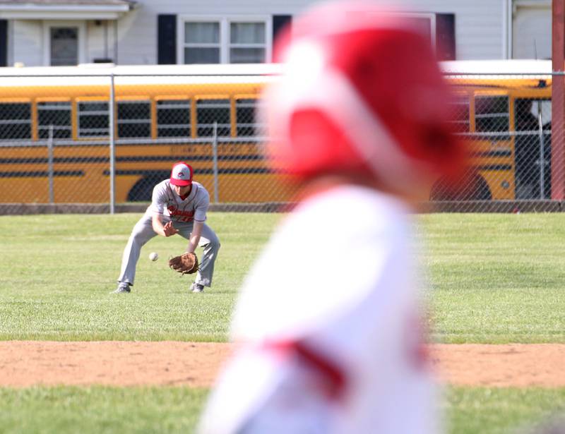 Ottawa's Hutson Hart fields a ground ball while Streator's Zander McCloskey rounds first base on Tuesday, May 16, 2023 at Streator High School.