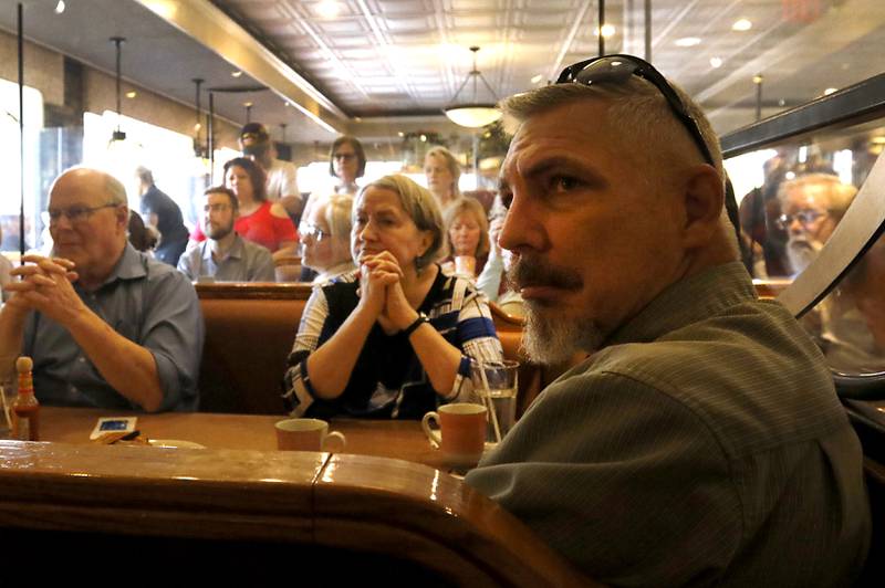 People listen to Republican candidate for governor Darren Bailey speak as he campaigns Wednesday, Sept. 21, 2022, at Around the Clock Restaurant, 5011 Northwest Highway, in Crystal Lake, during a nine-city bus tour, with his Lt. Governor candidate Stephanie Trussell.