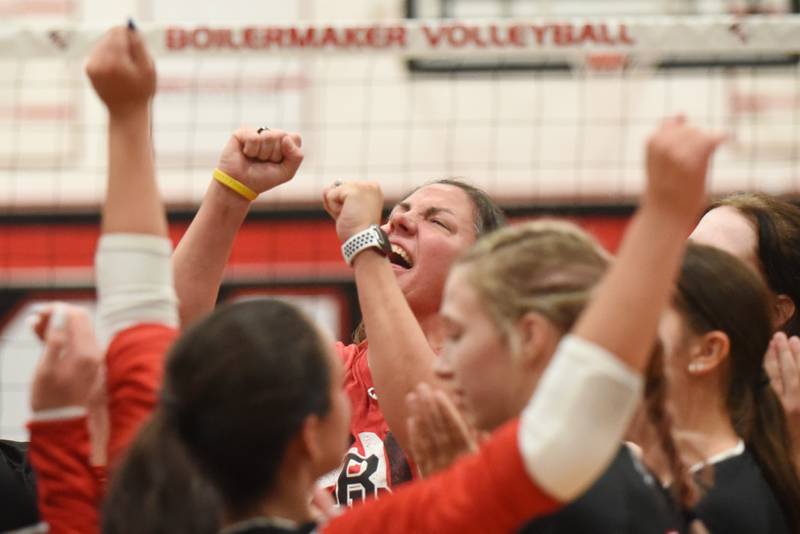 Bradley-Bourbonnais girls volleyball coach Leigh Reiniche celebrates with her Boilermakers following their 2-0 win over Bishop McNamara for the All-City championship at Bradley-Bourbonnais Wednesday, Sept. 10, 2025.