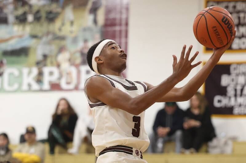 Lockport’s Logan Cooper lays in a shot against Lincoln-Way East on Friday, Dec. 1, 2023 in Lockport.