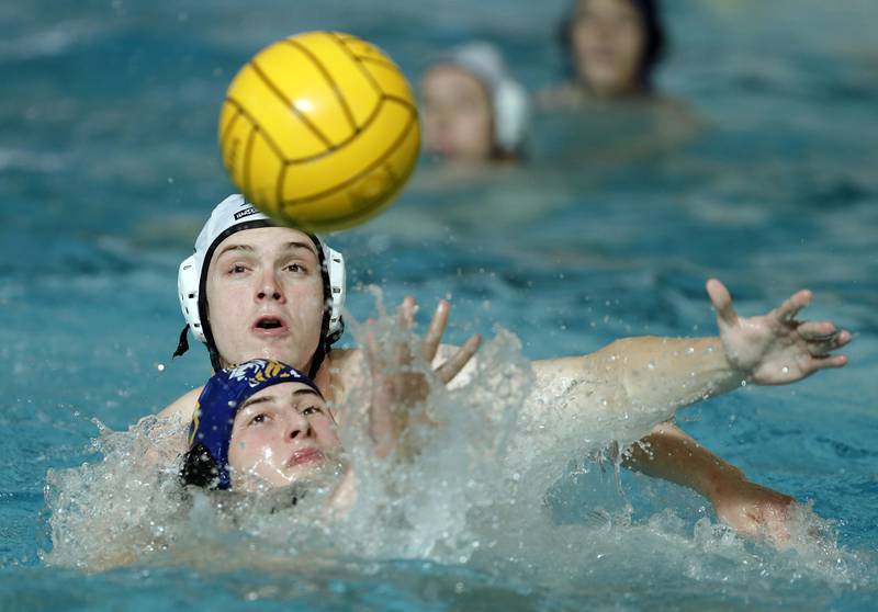 YorkÕs Charlie McKenna (6) battles Lyons' Louis Grib (3) for control of the ball during the IHSA State Water Polo consolation match Saturday May 20, 2023 at Stevenson High School in Lincolnshire.