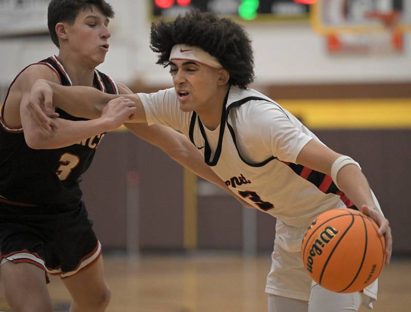 Barrington’s Luke Loughlin defends against Benet’s Jayden Wright in a boys basketball game at the Jacobs Hinkle Classic semifinals in Algonquin on Tuesday, Dec. 23, 2025.