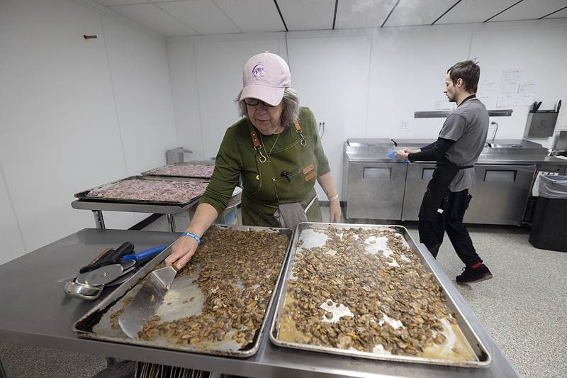 Prep manager Karen Jones stirs up mushrooms Friday, Jan. 10, 2025, at Lena’s kitchen in downtown Dixon. The upscale comfort food restaurant is poised for a late February opening but in the meantime is making and selling pizza.