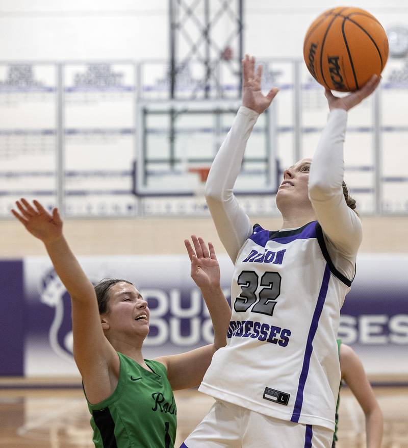 Dixon's Makenzie Toms puts up a shot over Rock Falls’ Elizabeth Lombardo Friday, Jan. 31, 2025, at Dixon High School.