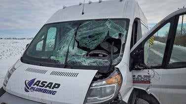 Chunk of ice from truck smashes through windshield of van near Marengo, injuring driver