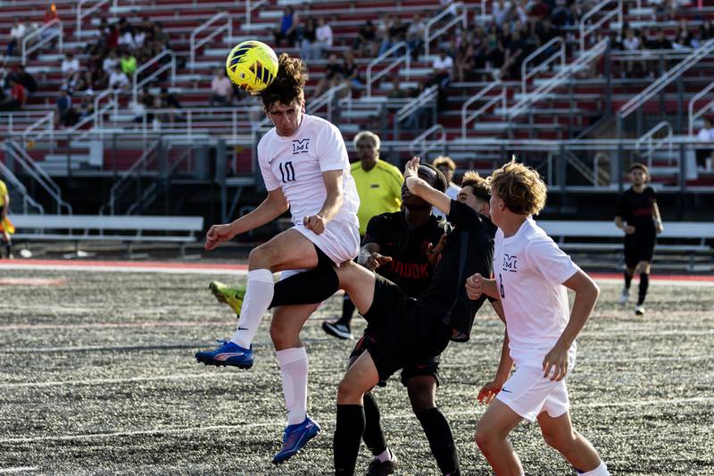 Minooka's Seth Koranda goes for a header during a varsity soccer away game against Bolingbrook on Sept. 16, 2025.