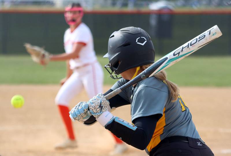 Harvard’s Tallulah Eichholz considers an offering from Crystal Lake Central’s Oli Victorine in varsity softball at Crystal Lake Central High School in Crystal Lake on Monday, May 19, 2025.