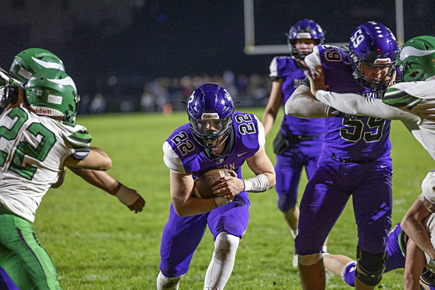 Dixon’s Aiden Wiseman runs up the middle for a first quarter TD against North Boone Friday, Oct. 20, 2023 in Dixon.