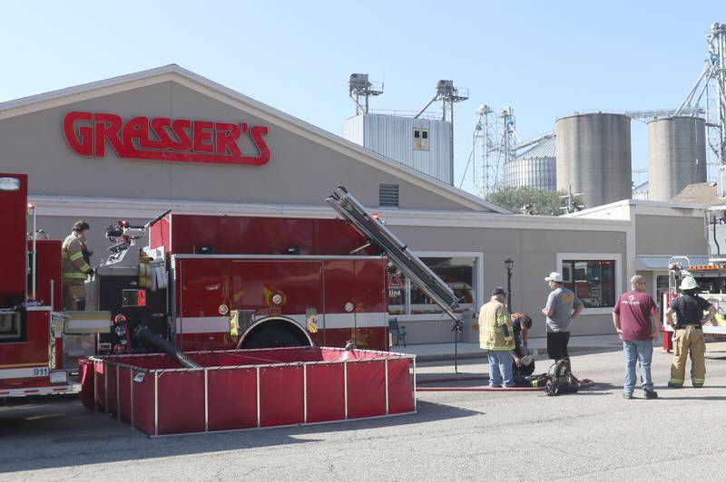 Firefighters work the scene of a fire at Grassers Heating and Plumbing on Wednesday, Sept. 17, 2025 in McNabb. The fire began shortly before 10a.m. A Mutual Aid Box Alarm System (MABAS) was elevated to the fourth-alarm. No one was injured in the fire. Fire departments from McNabb, Peru, Utica, Henry, Ladd, Hennepin, Granville, Oglesby, Spring Valley, Leonore, Troy Grove, Seatonville, Wenona, Standard, Lacon-Sparland, Bureau and Tonica all responded to the scene. Firefighters left the scene at 11:30a.m.
