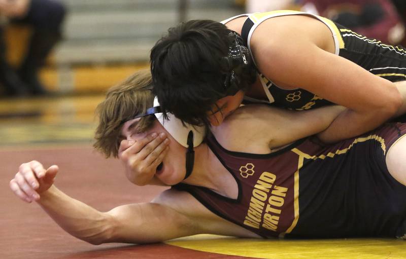 Harvard’s Reymundo Romo controls Genoa-Richmond-Burton’s Clay Madular during their 113-pound third place wrestling match in the IHSA 1A Richmond-Burton Wrestling Regional Thursday, Jan. 19, 2023, at Richmond-Burton High School in Richmond.