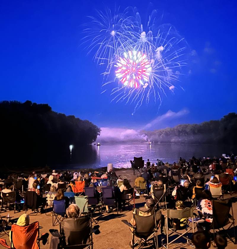 T=he crowd watches as a firework ignites in a sea of color over the Rock River at Prophetstown State Park on Saturday, July 6, 2024.