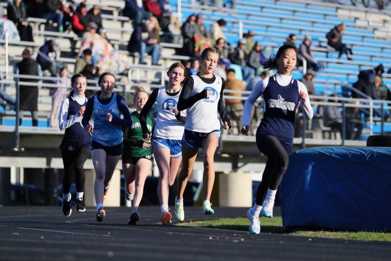 Princeton's Lexi Bohms and Avery Waca run in Thursday's Howard-Monier Girls Invitational at Princeton.