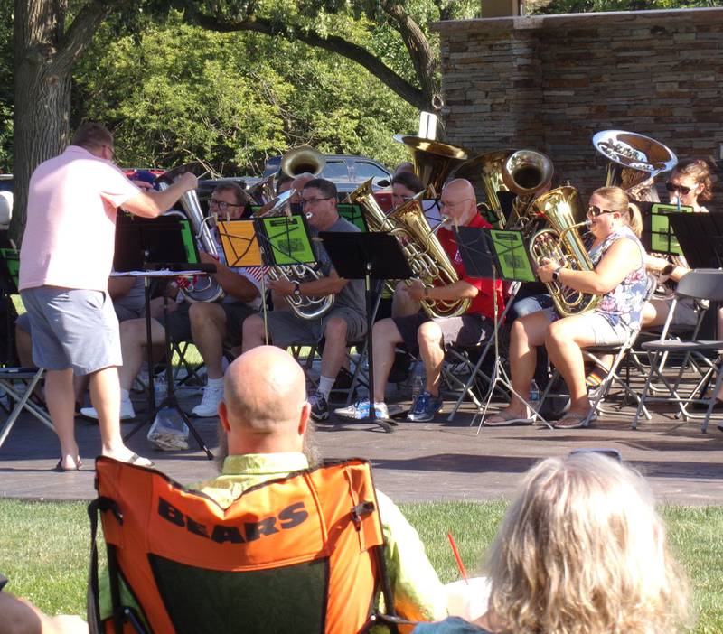 Tuba players perform during the inaugural SUMMERTUBAFEST concert Sunday, July 31, 2022, at Centennial Park in Peru.