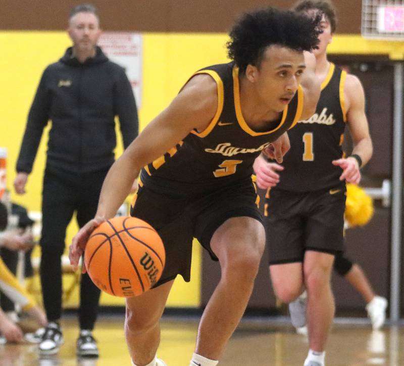 Jacobs’ Jordan O’Connor moves the ball against Cary-Grove during Hinkle Holiday Classic varsity boys basketball tournament action on Thursday, Dec. 26, 2024 at Jacobs High School in Algonquin.