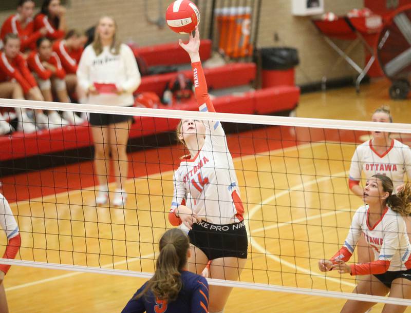 Ottawa's Libby Muffler reaches up to spike the ball to Pontiac's Alexis Lenger on Tuesday, Sept. 9, 2025 at Kingman Gymnasium.