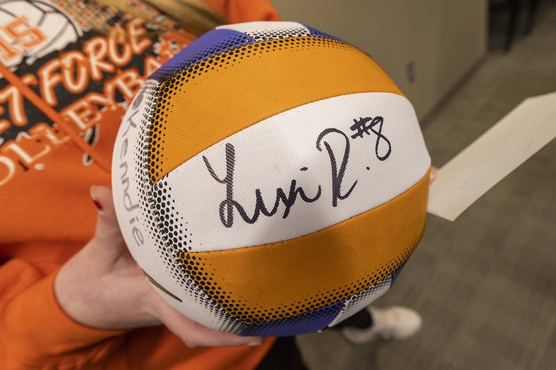 Lexi Rodriguez signed volleyballs and pictures Monday, Dec. 23, 2024, at Sterling City Hall.