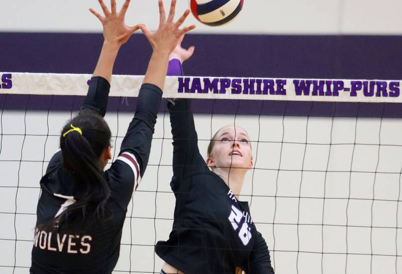 Hampshire’s Anna Schiltz, right, hits the ball against Prairie Ridge in varsity girls volleyball at Hampshire High School in Hampshire on Tuesday, Sept. 2, 2025.