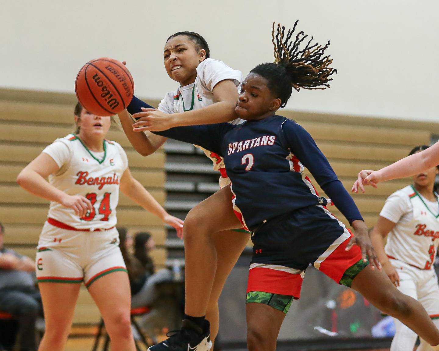 Romeoville's Kazaria Smith (2) battles for possession during basketball game between Romeoville at Plainfield East. Feb 8, 2024.