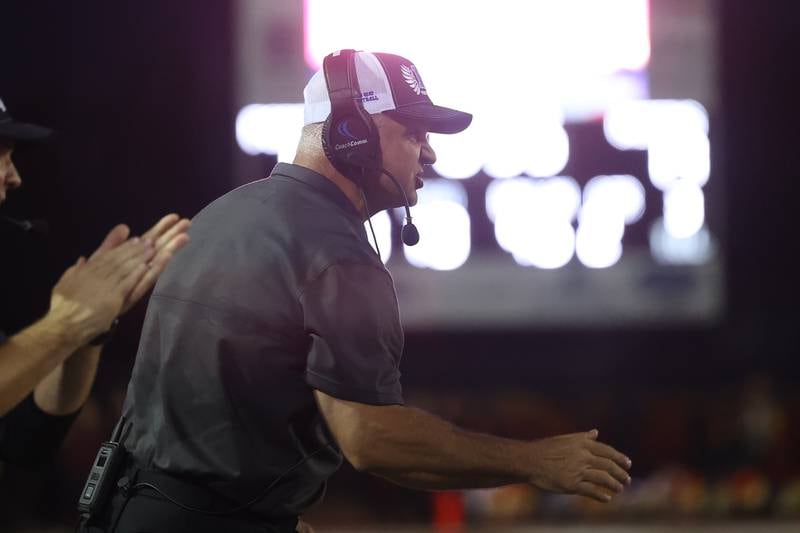 Lincoln-Way East’s head coach Rob Zvonar yells out to his players during the game against Lockport on Friday, Sept. 29, 2023 in Lockport.