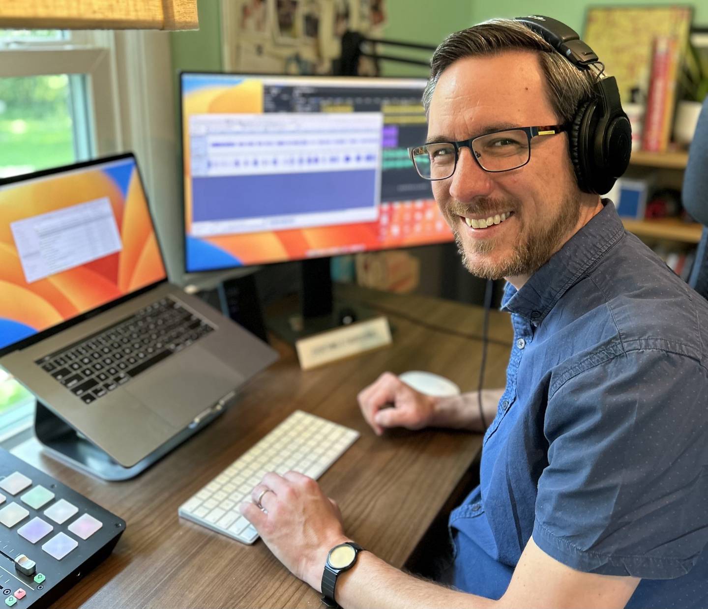 Richard Clark, owner of Area Code Audio poses for a photo in his home studio in Batavia.