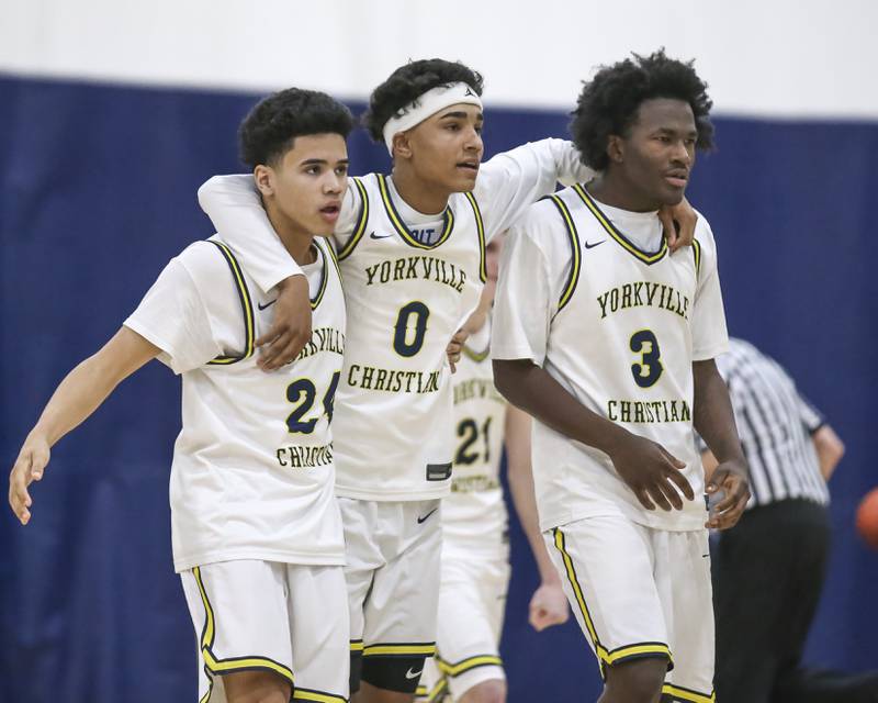 Yorkville Christian's Yorkville Christian's Jayden Alford (24),  Blake Wells (0) and Jayden Riley (3) walk off the court after winning their their basketball game against Christ the King, Feb 6, 2026 in Yorkville.