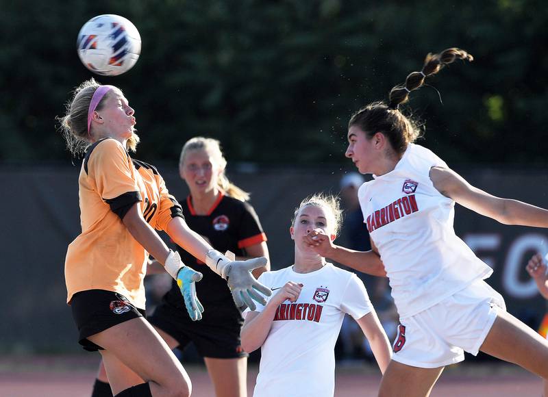 Barrington’s Sarah Sarnowskiheads the ball past Libertyville’s Kaate Hopma for a goal in the IHSA girls state soccer semifinal game at North Central College in Naperville on Friday, June 2, 2023.