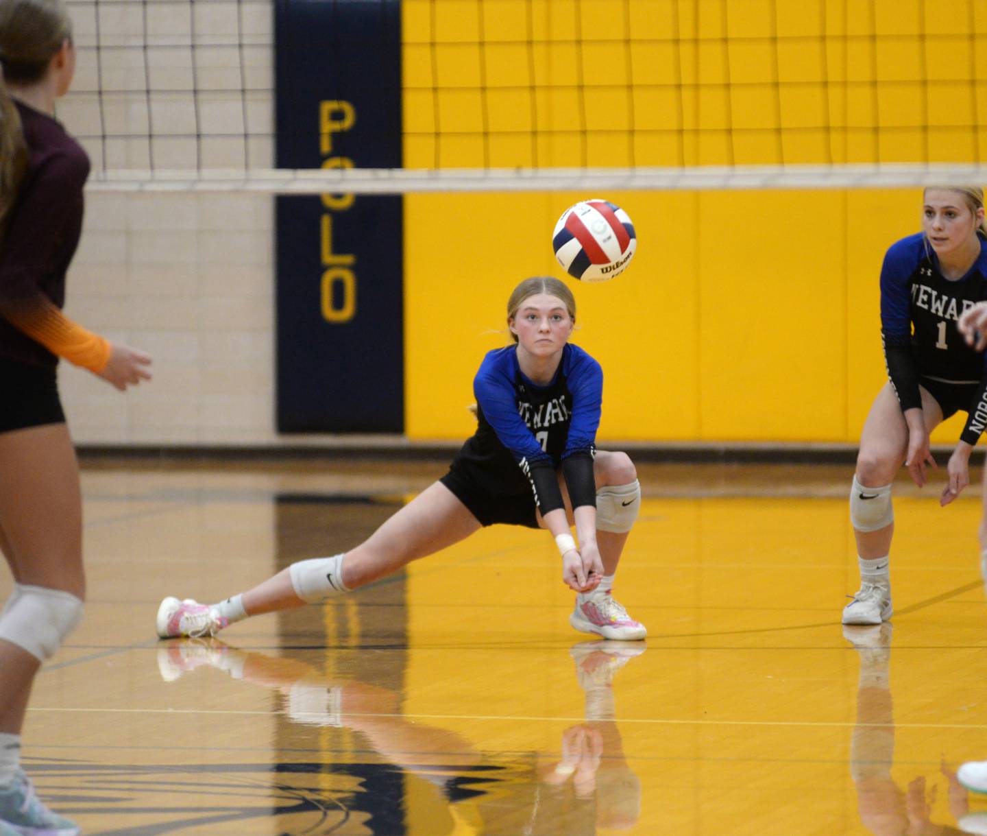 Newark's Adrianna Larsen (7) focuses on the ball as she receives a serve against Stockton during 1A action at the Polo Sectional on Tuesday, Nov. 5, 2024 at Polo High School.