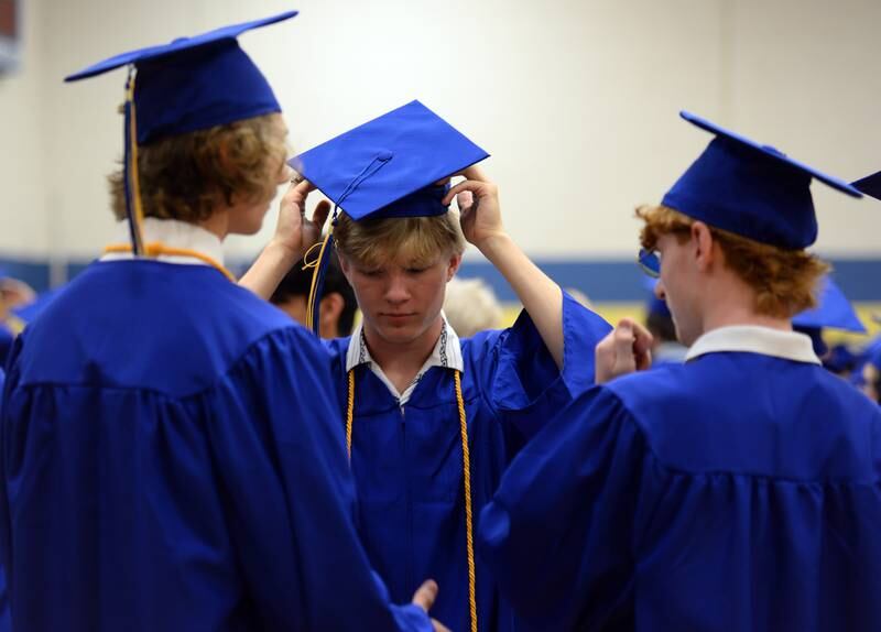 Lyons Township's Matthew Gatland of Western Springs adjusts his cap prior to their graduation Wednesday May 25, 2022.