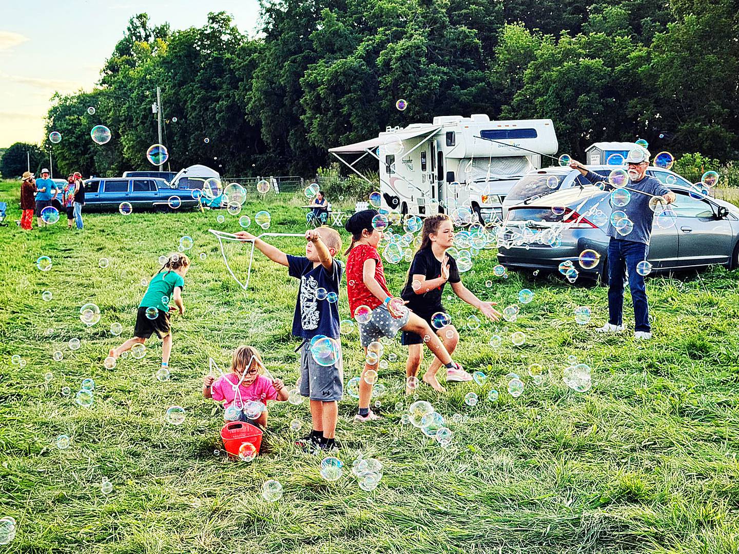 The Willow Folk Festival attracts people of all ages, including children who enjoy running amok and engaging in activities and meeting new friends.