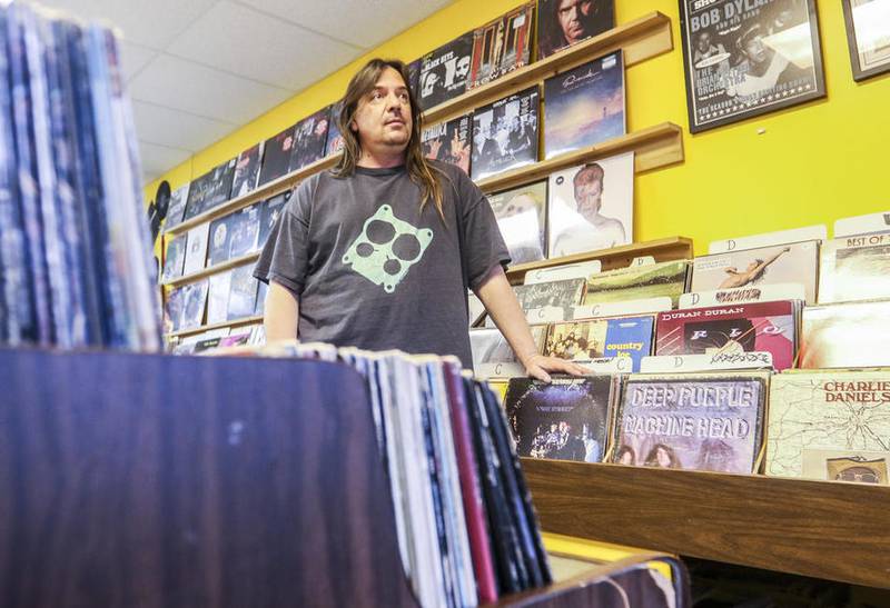 Tim Wille, owner of Vinyl Frontier Records, poses for a portrait at his McHenry shop.