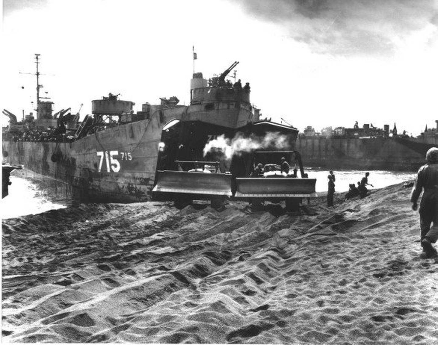 The LST-715 was at Iwo Jima, as well as several campaigns in the Korean War. In 1955, it was renamed the USS DeKalb County, in honor of the six United States counties with that name.