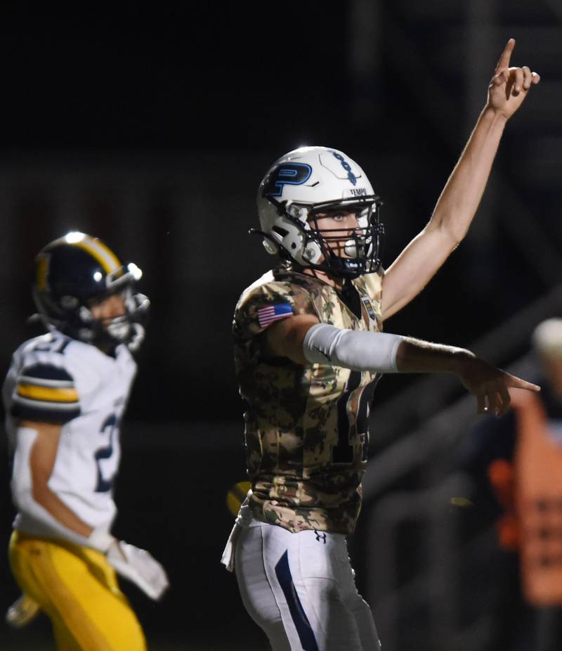 Joe Lewnard/jlewnard@dailyherald.com
Prospect quarterback Jack Skoog celebrates his second-quarter touchdown during Thursday’s game against Glenbrook South.