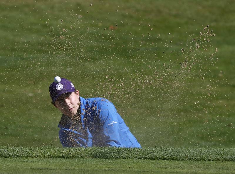 Hampshire’s Eric Brown hits out of the sand trap on the fourth hole during the Fox Valley Conference Boys Golf Tournament. Thursday, Sept. 22, 2022, at Randall Oaks Golf Club in West Dundee.