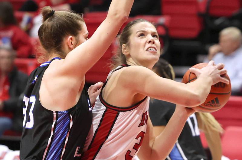 Northern Illinois' Brooke Stonebraker looks to shoot over Eastern Illinois' Macy McGlone during their game Monday, Dec. 18, 2023, at the Convocation Center at NIU in DeKalb.