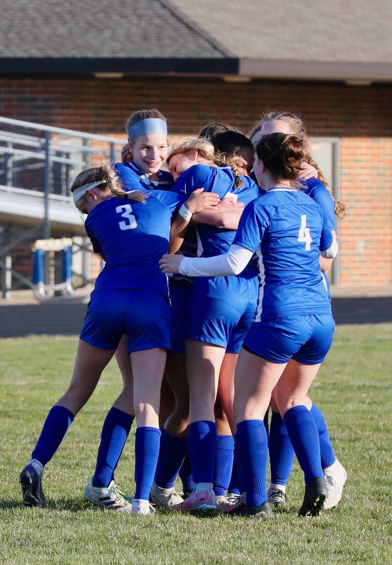 Princeton players surround teammate Mariah Hobson after she scored her 100th career goal Tuesday at Bryant Field. She scored five goals to lead Princeton to a 7-0 win over IVC.