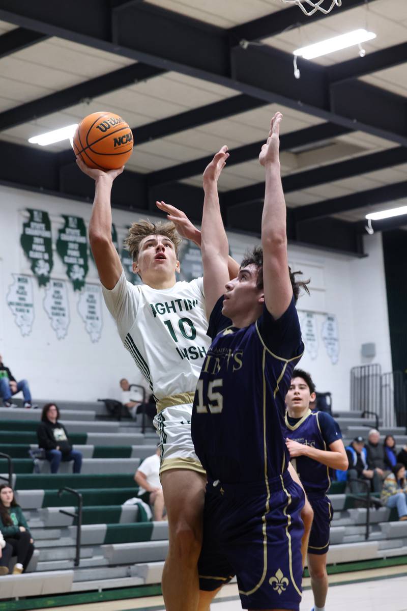Bishop McNamara's Coen Demack looks to shoot under pressure during the Fightin' Irish's 62-25 victory over Chesterton Academy on Wednesday, Jan. 7, 2026.