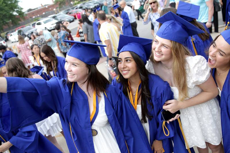 Lyons Township High School graduates (from left) Avery Neusel, Alexandra Nicola, Molly Burke and Phebe Moulfarha pose for a photo before the school’s 2023 commencement ceremony in Western Springs on Wednesday, May 31, 2023.