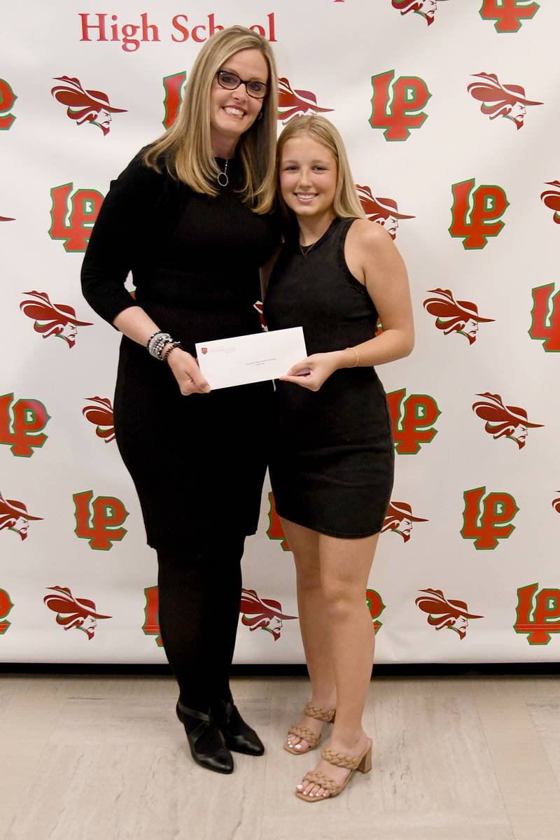 Kaylie Reese (right) received the City Center Physical Therapy Scholarship, presented by Gina Martin (left). The $1,000 scholarship is awarded to a student pursuing a career in physical therapy or sports medicine. The scholarship is given to a student who has a GPA of at least 3.25 and is accepted to a college or university.