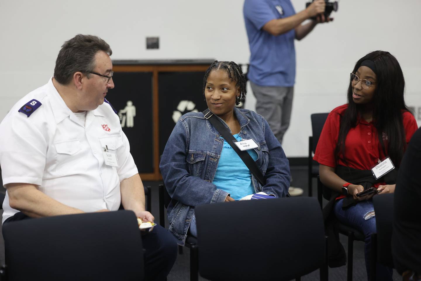 Scott Hurula, with the Salvation Army, left, speaks with summer interns Alice Ward and Deanna Applegate at the celebration of the first Will County Summer Internship Program organized by the Will County Center for Economic Development on Wednesday, Aug. 7, 2024 in Joliet.