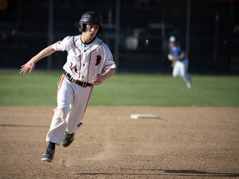 Beecher's Nolen Lane heads to third on his way to score in the sixth inning of a game against Central on April 29, 2025.