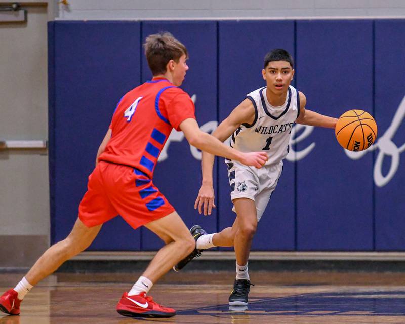 West Chicago's Marcus Brewell (1) dribbles the ball up the court while being defended by Glenbard South's PJ Lehr (4) during the game on Friday Jan. 3, 2025, held at West Chicago High School.