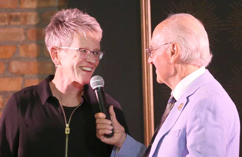 Mendota alumna Tracy Stroyan-Maynard chats with emcee Lanny Slevin during the 2025 Shaw Media Illinois Valley Sports Hall of Fame at the Auditorium Ballroom in La Salle.