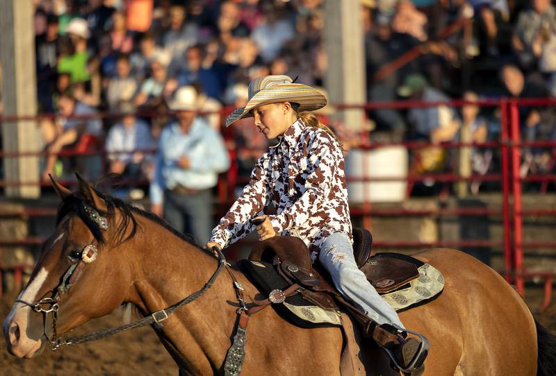 Kinley Northrup competes in the barrel racing event Thursday, August 7, 2025, at Carroll County Fair’s T and A Bucking Bulls Rodeo.