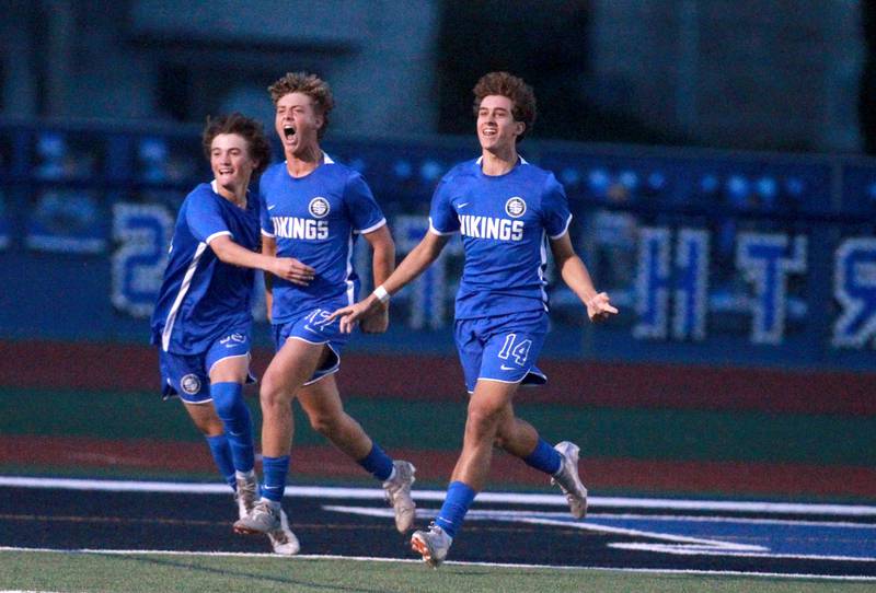 Geneva’s Chase Marquardt, Ben Murphy and Alec Graham (left to right) celebrate Murphy’s goal during the Class 3A St. Charles North Sectional semifinal against Glenbard West on Tuesday, Oct. 29, 2024, in St. Charles.